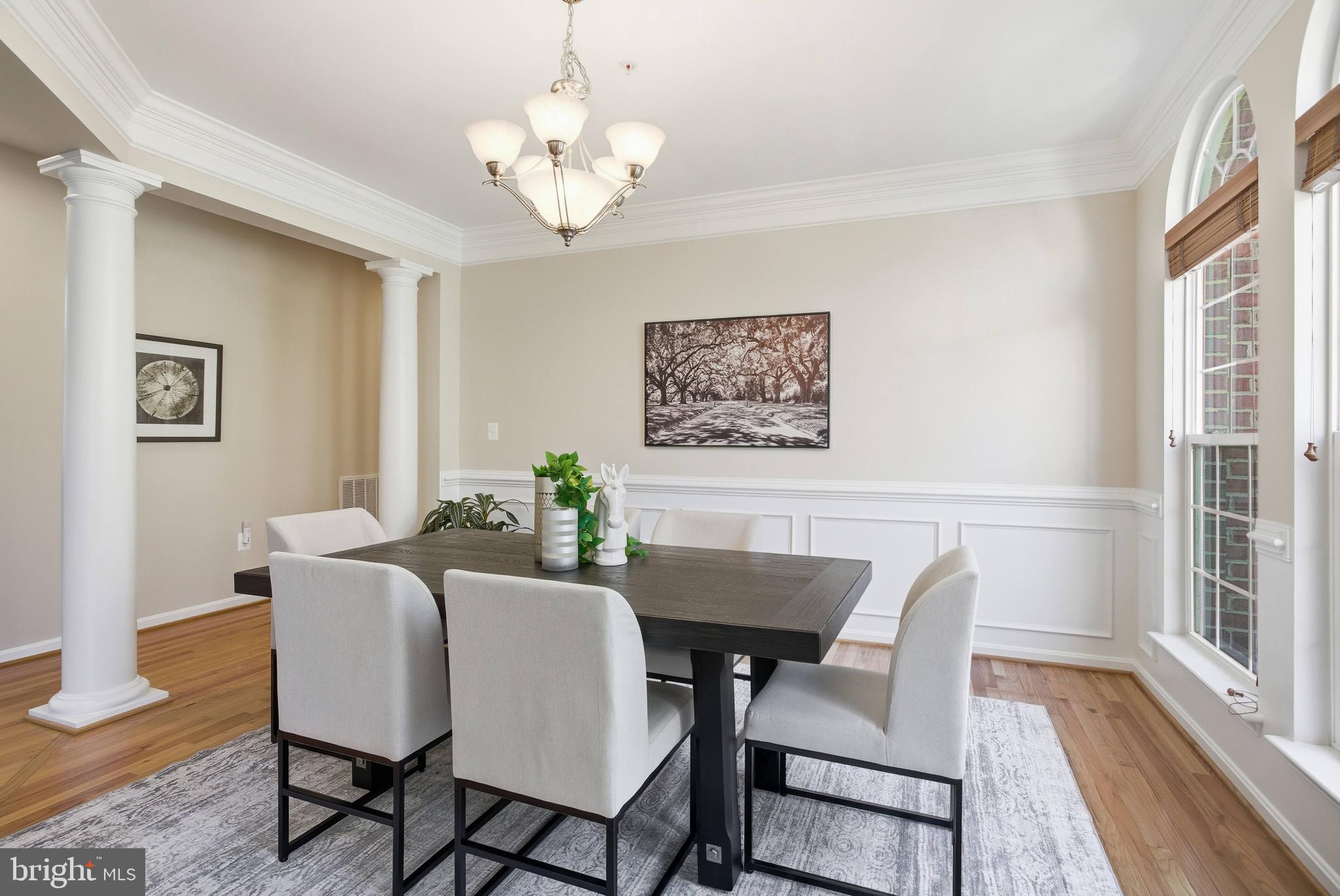 9013 Helmsley Drive Clinton, MD 20735 - Photo 20 of 68 a view of a dining room with furniture wooden floor and a chandelier