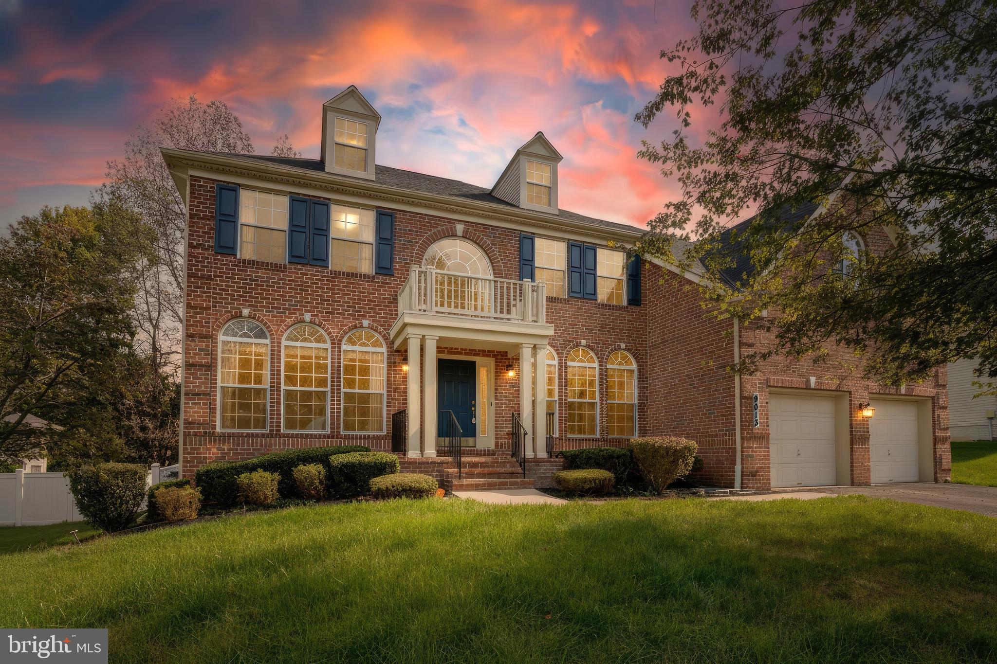 9013 Helmsley Drive Clinton, MD 20735 - Photo 2 of 68 a front view of a house with a yard