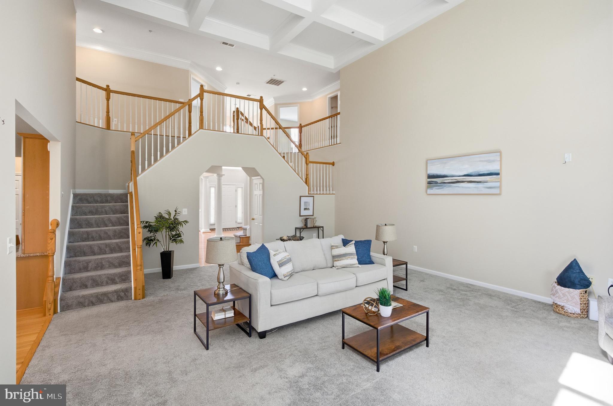 9013 Helmsley Drive Clinton, MD 20735 - Photo 29 of 68 a living room with furniture and a chandelier