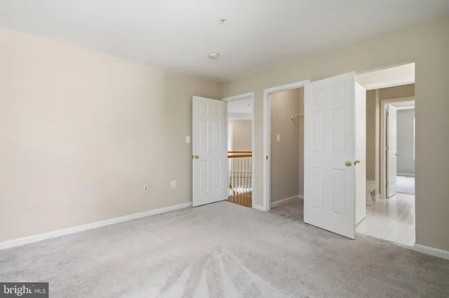 a spacious bathroom with a tub sink and mirror