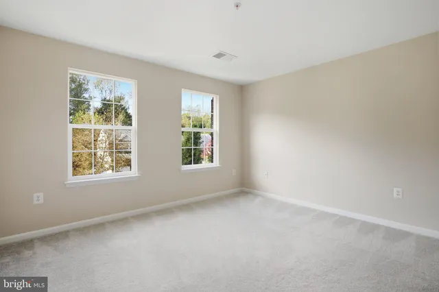 a view of room with wooden floor