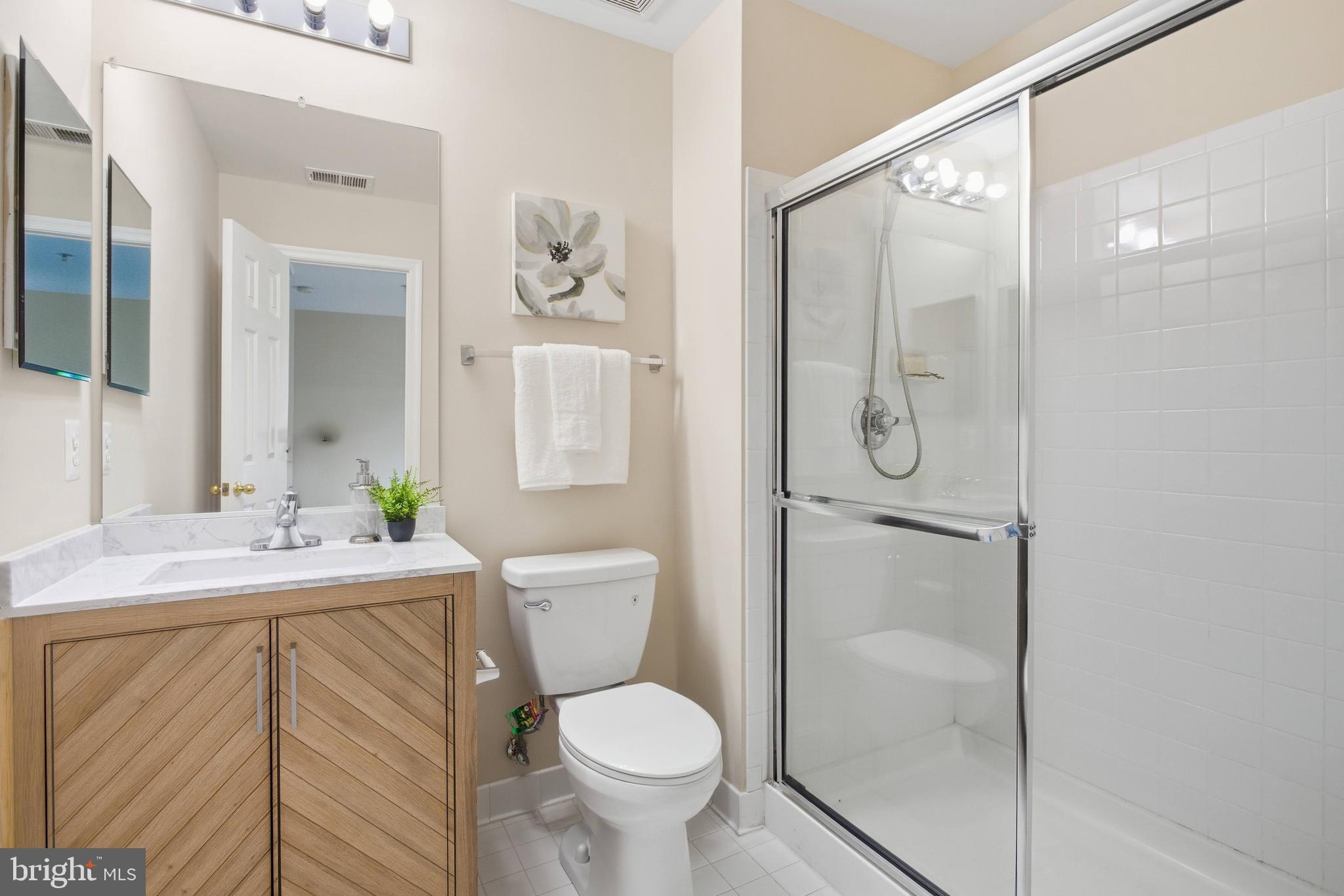 9013 Helmsley Drive Clinton, MD 20735 - Photo 41 of 68 a bathroom with a toilet sink and shower