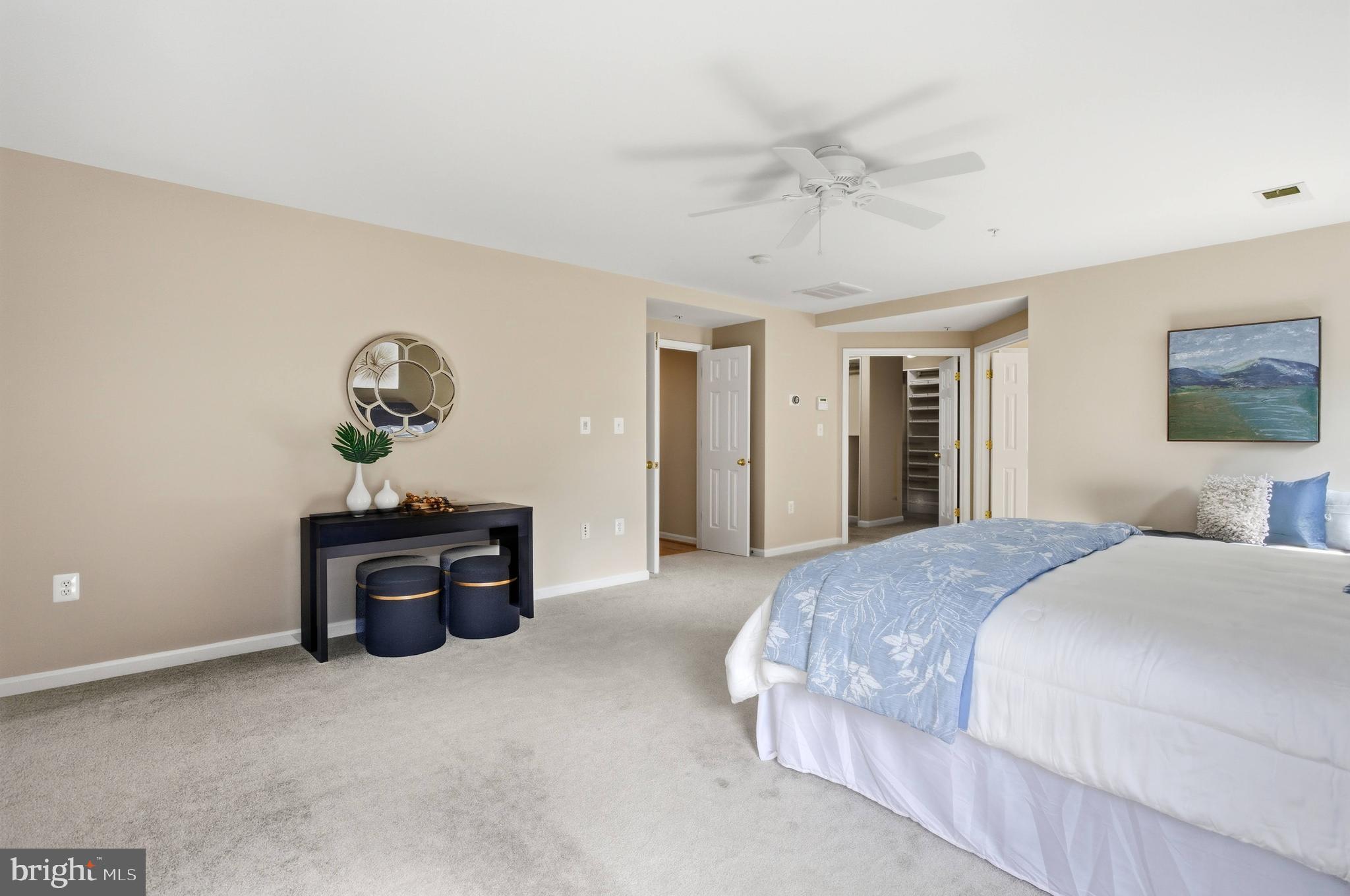 9013 Helmsley Drive Clinton, MD 20735 - Photo 44 of 68 a spacious bedroom with a bed and a chandelier
