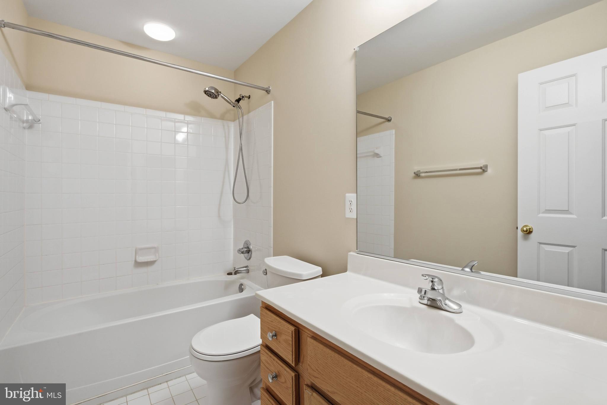9013 Helmsley Drive Clinton, MD 20735 - Photo 53 of 68 a bathroom with a sink toilet tub and shower
