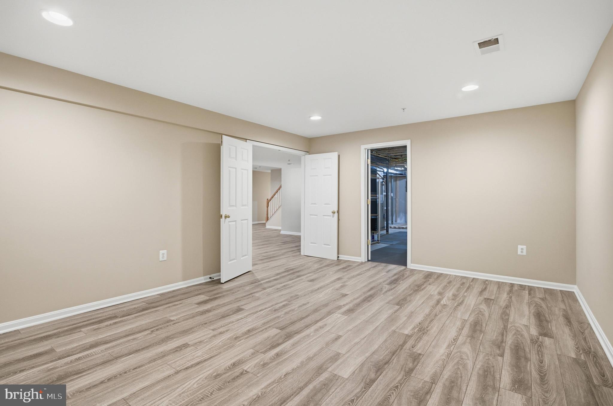9013 Helmsley Drive Clinton, MD 20735 - Photo 61 of 68 a view of an empty room with wooden floor and closet