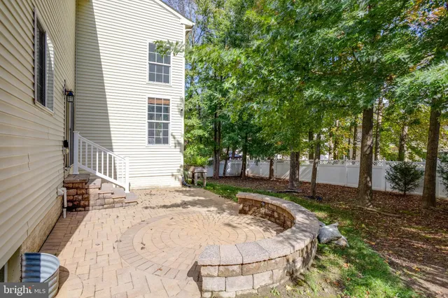 a view of a tree in the middle of a yard