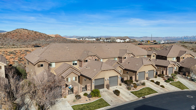 4269 Razor Drive Washington, UT 84780 - Photo 40 of 50 View of front of home with driveway, stucco siding, a tiled roof, a garage, and a mountain view