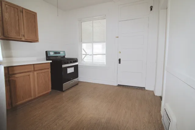 a view of cabinets and window