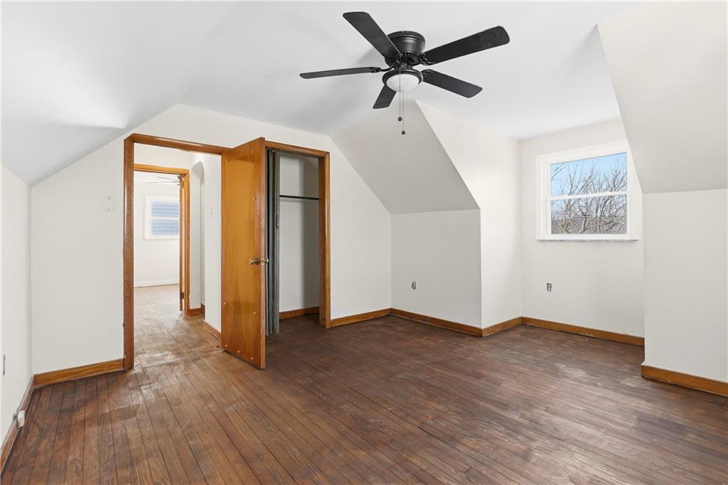 1865 Montour St Extension Coraopolis, PA 15108 - Photo 21 of 41 a view of an empty room with wooden floor and a ceiling fan