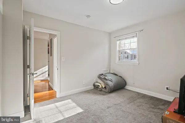 a view of room with window and furniture