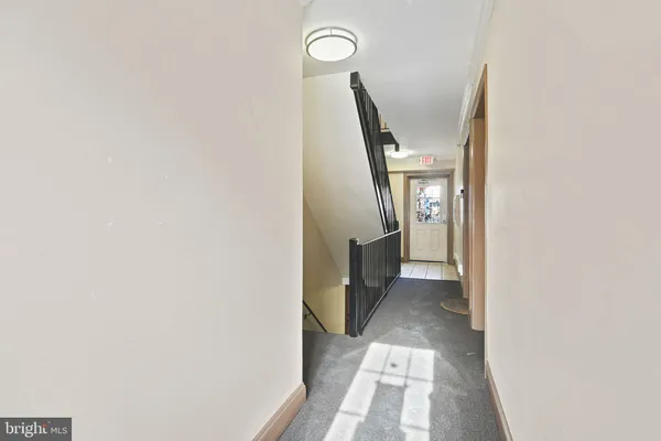 a view of a hallway with front door