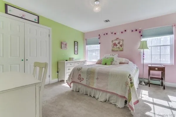 a bedroom with a bed and a table