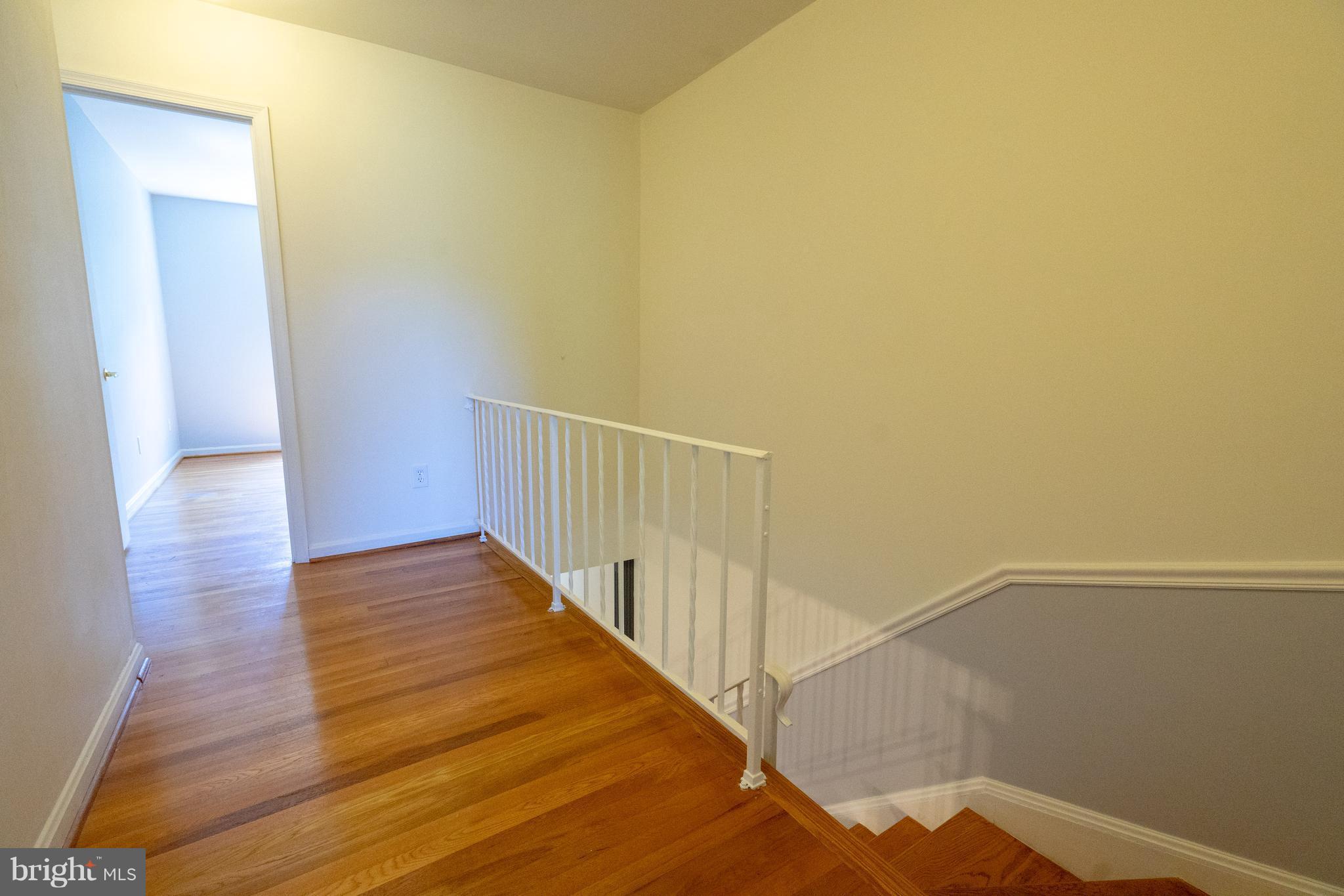 3857 Chain Bridge Road Fairfax, VA 22030 - Photo 13 of 30 Hardwood floors and stairs. Custom iron railings.
