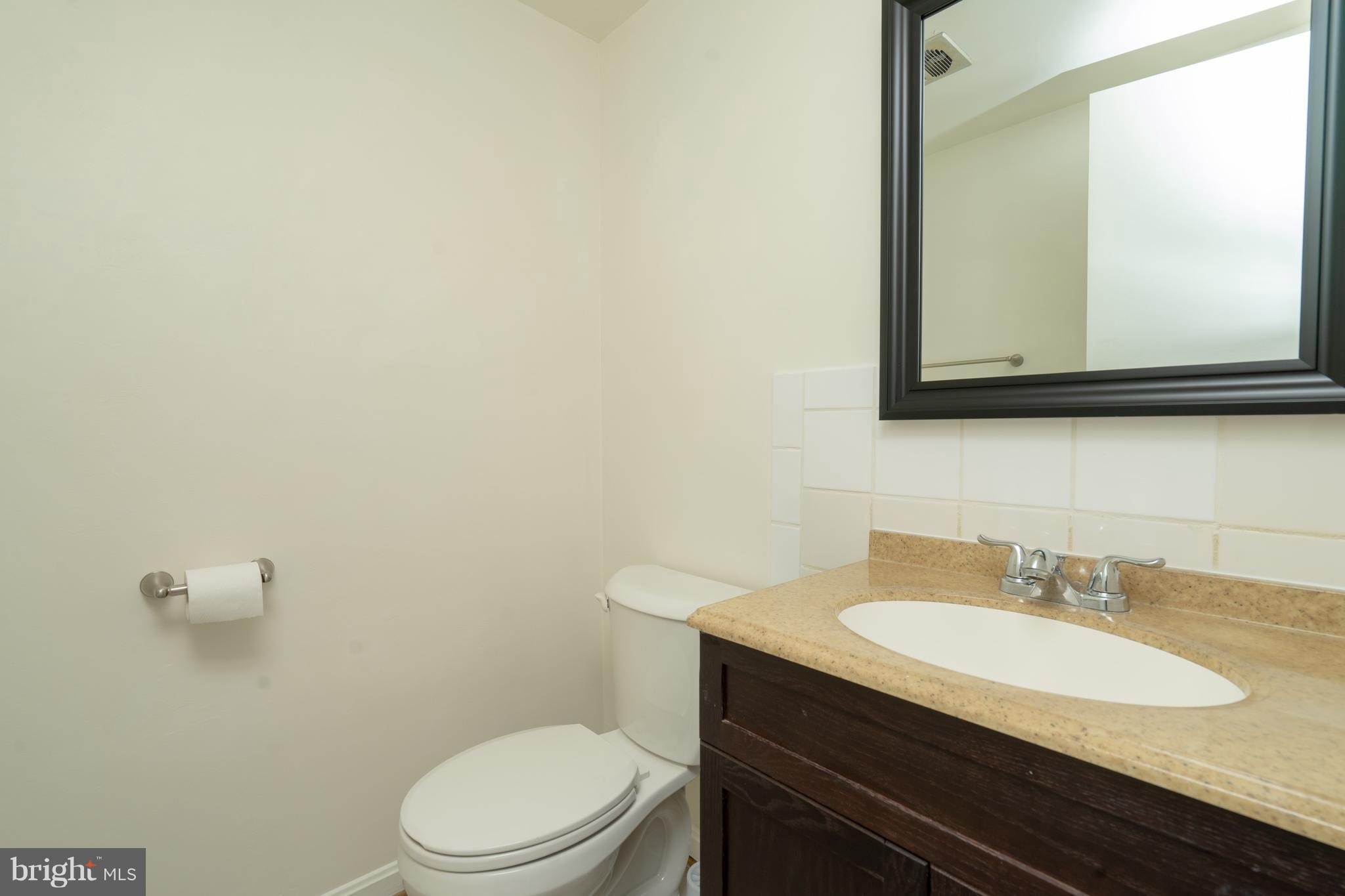 3857 Chain Bridge Road Fairfax, VA 22030 - Photo 8 of 30 Main level half bathroom (powder room)