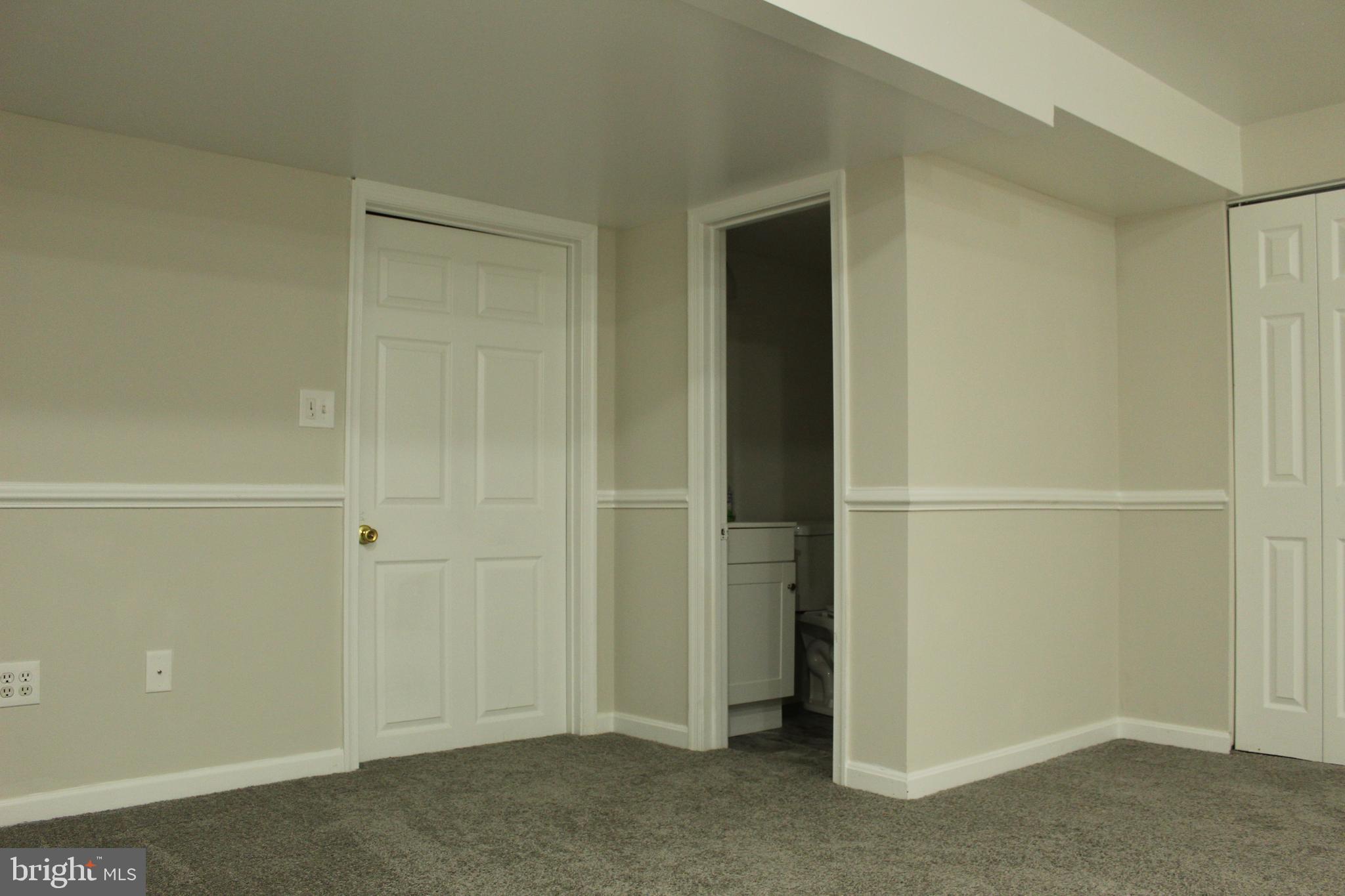 310 Rambling Ridge Court Pasadena, MD 21122 - Photo 8 of 18 Family Room with Half Bath Room