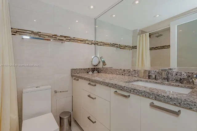 a bathroom with a shower and a bathtub