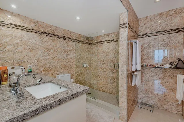 a bedroom with 2 bed and a window