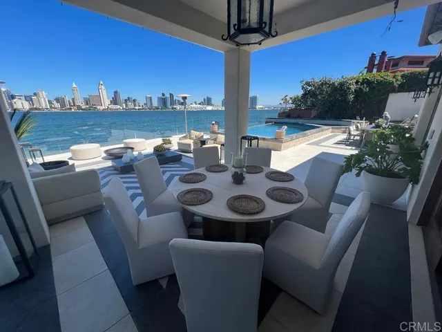 a view of an outside dining space with furniture