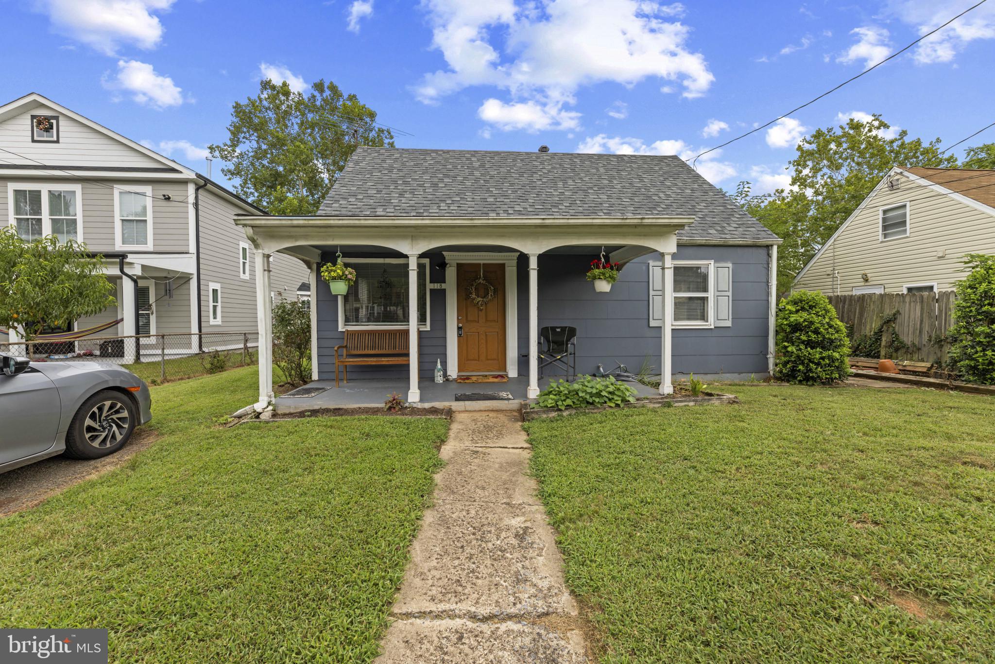 118 Mace Street Manassas Park, VA 20111 - Photo 1 of 25 front view of a house with a garden