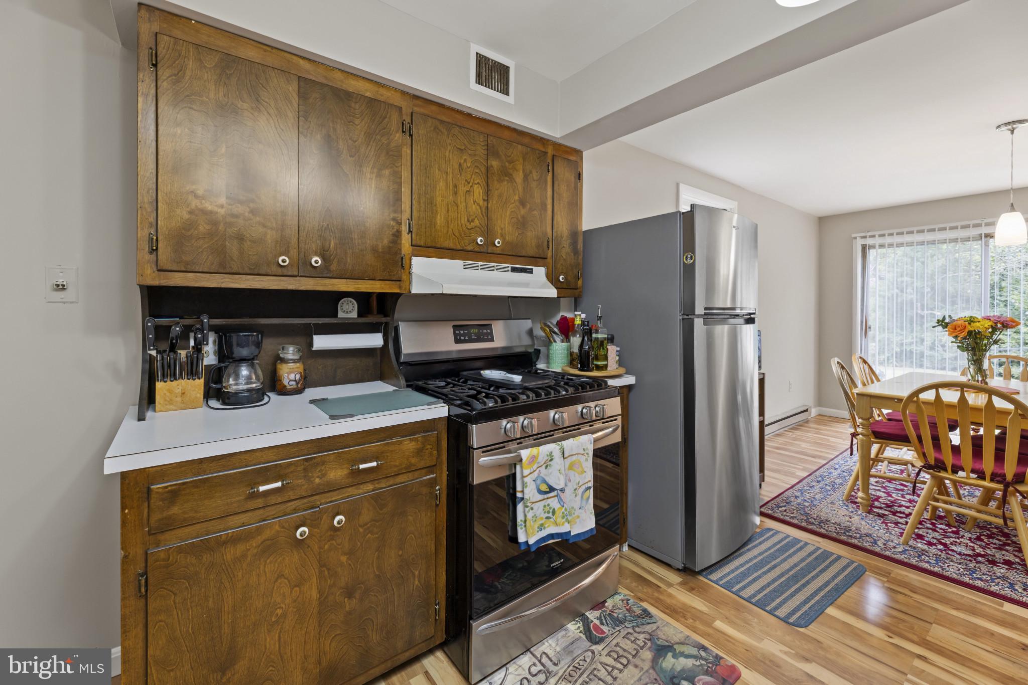 118 Mace Street Manassas Park, VA 20111 - Photo 16 of 25 a kitchen with stainless steel appliances granite countertop a stove a refrigerator and a refrigerator