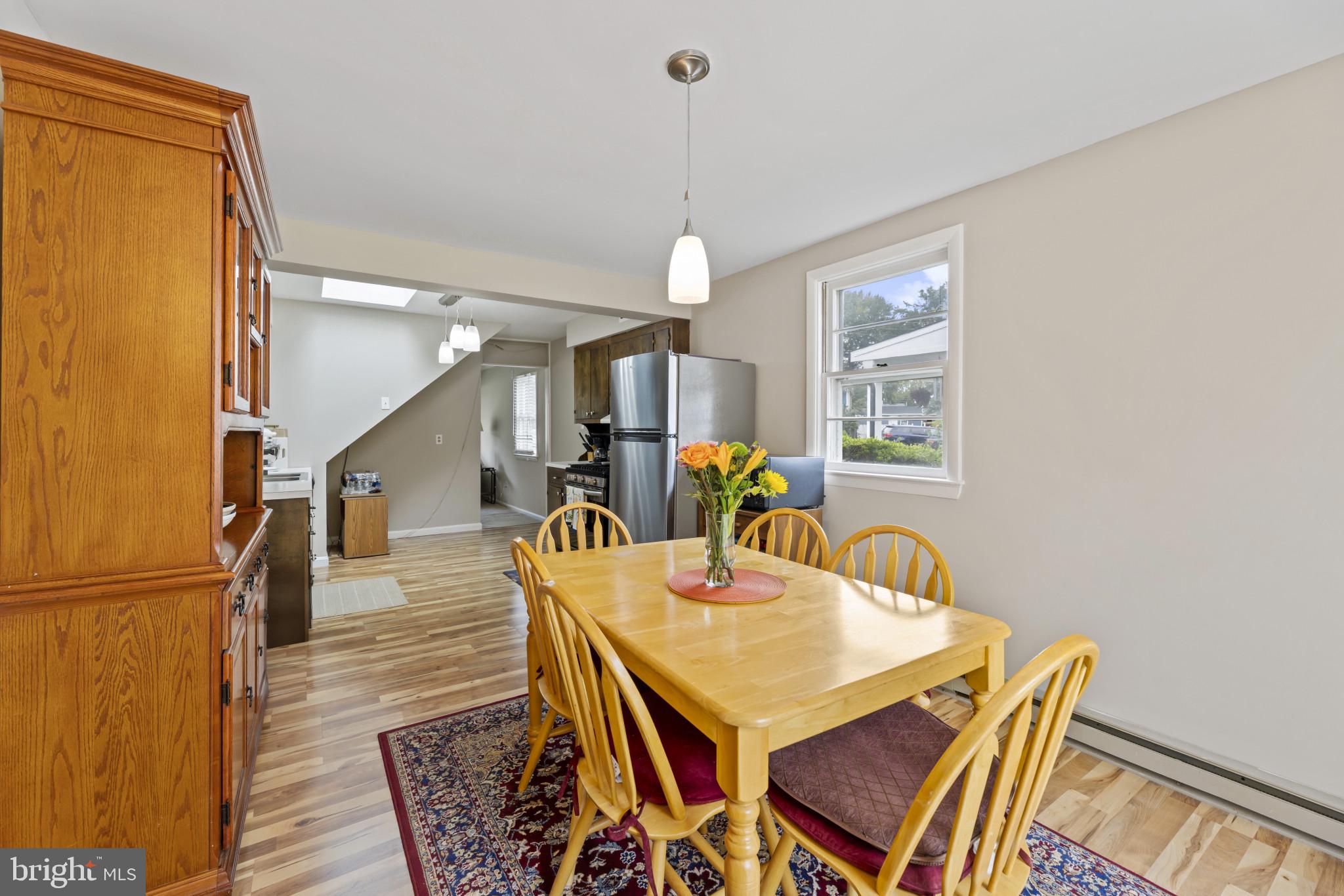 118 Mace Street Manassas Park, VA 20111 - Photo 19 of 25 a view of a dining room with furniture and wooden floor