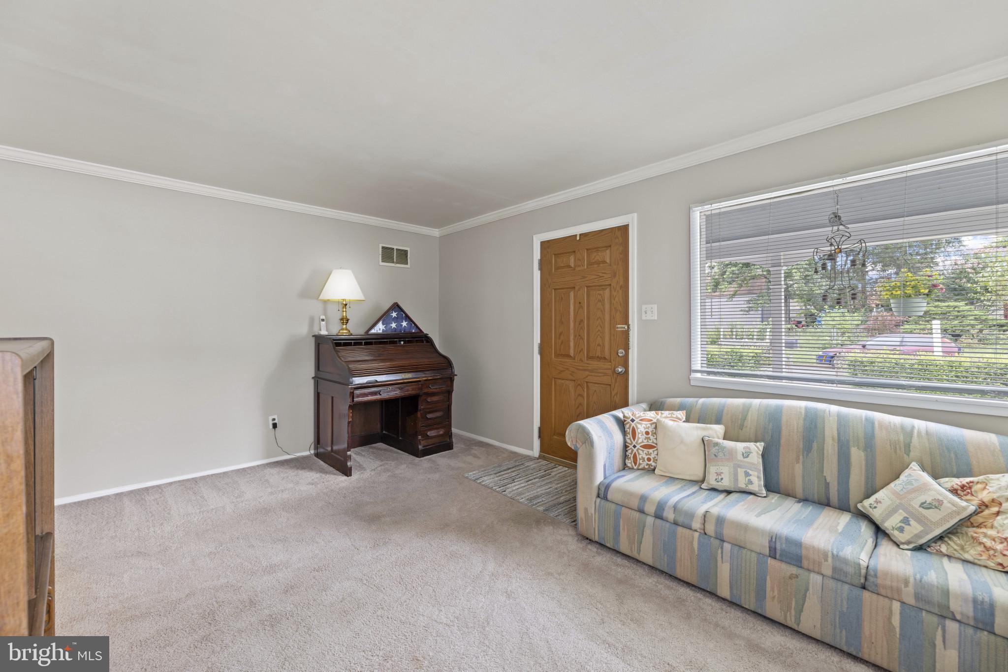 118 Mace Street Manassas Park, VA 20111 - Photo 5 of 25 a living room with furniture and a window