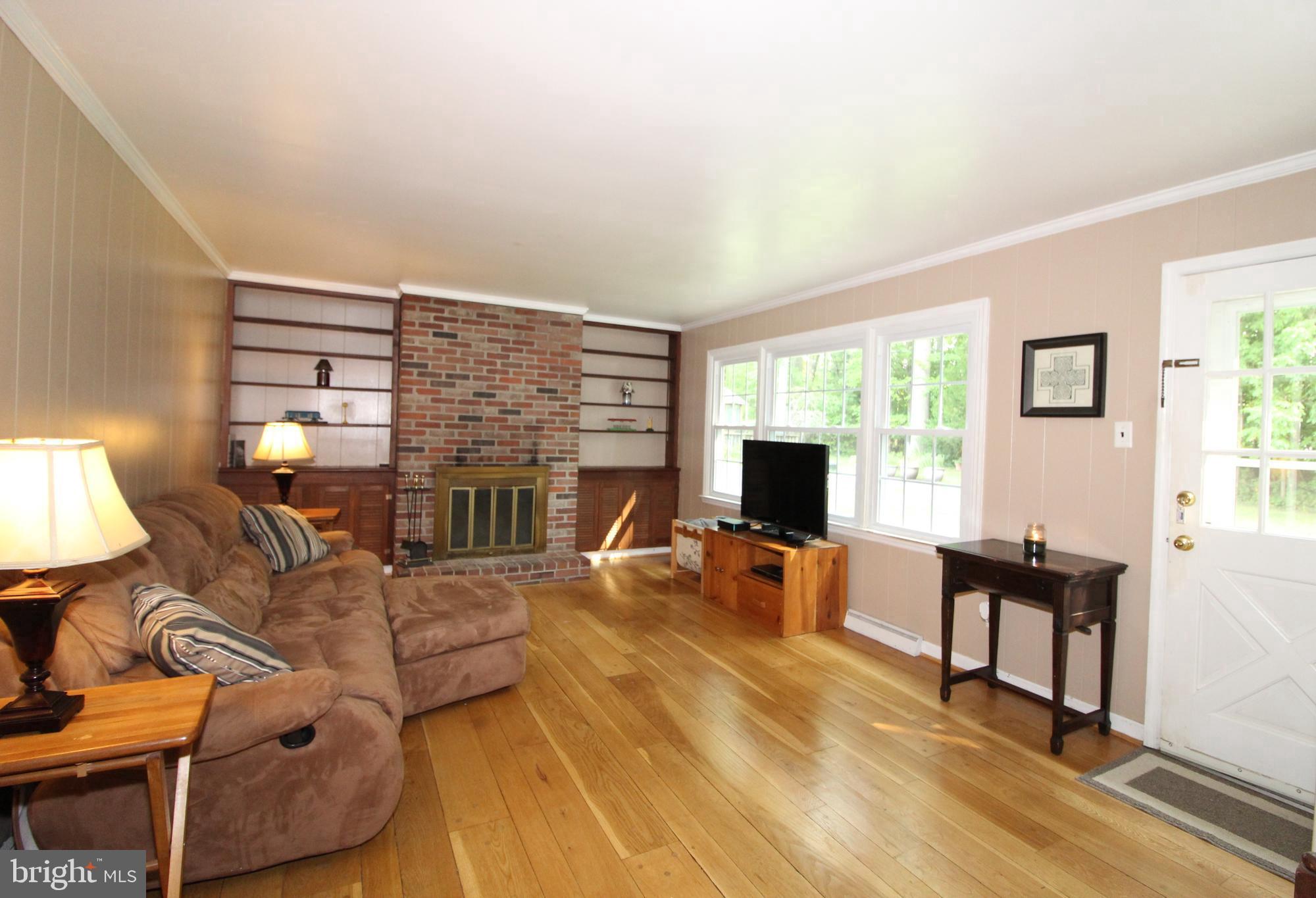 714 Halstead Road Wilmington, DE 19803 - Photo 13 of 38 Open Family Room w/Brick Fireplace & Built-ins
