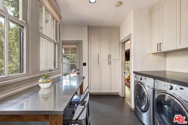 a view of a kitchen and dining room with windows