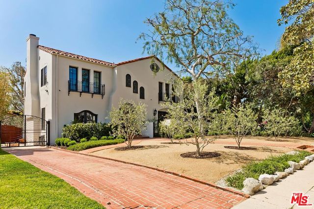 a house with yard in front of it