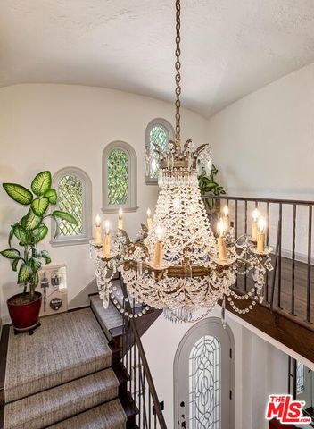 a view of a living room and chandelier