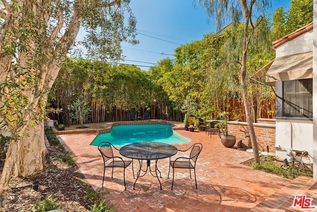 a view of a park with large trees