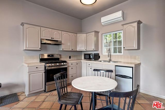a bathroom with a sink a toilet and bathtub