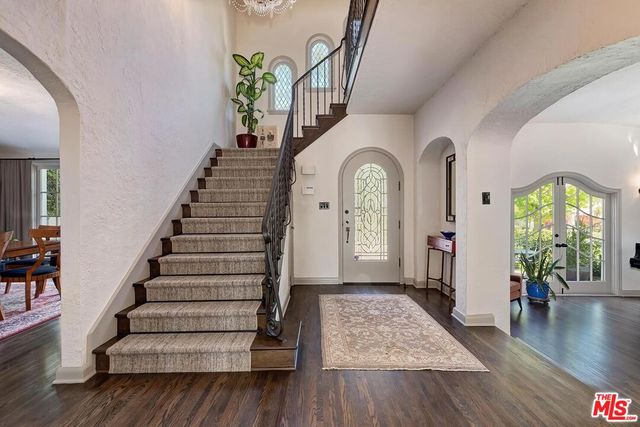a view of entryway with wooden floor