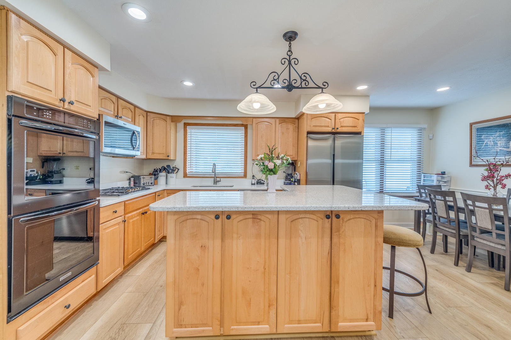 1716 Beech Road Mount Prospect, IL 60056 - Photo 16 of 28 a large kitchen with a table and chairs in it