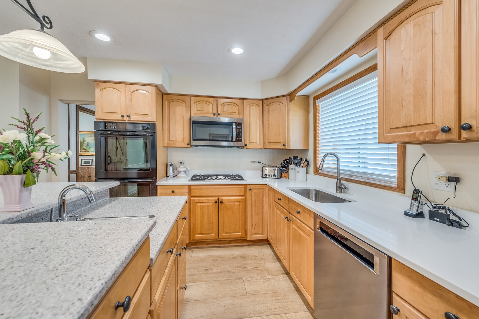 1716 Beech Road Mount Prospect, IL 60056 - Photo 9 of 28 a kitchen with kitchen island granite countertop a sink counter top space appliances and cabinets