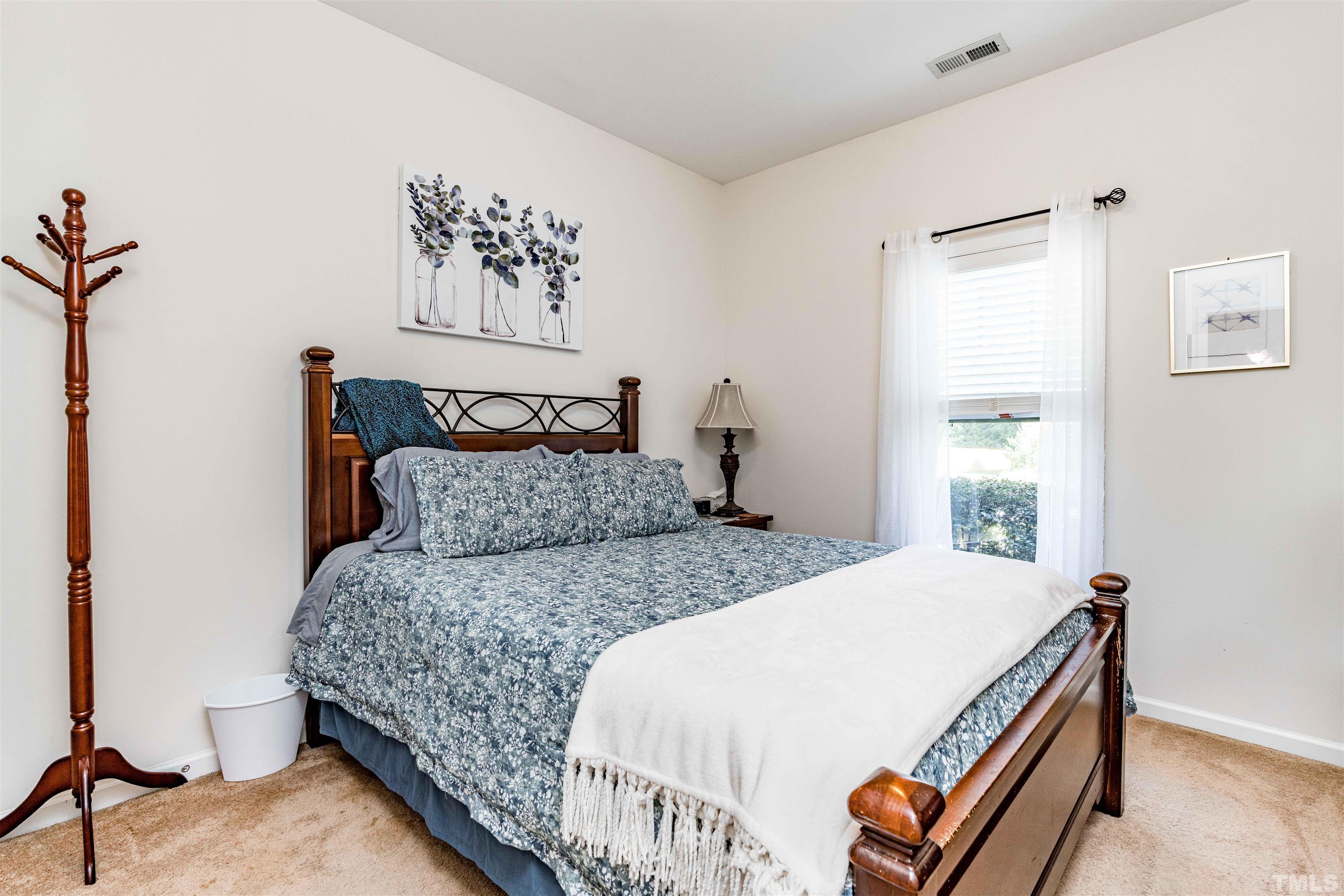 180 Crane Way Bunnlevel, NC 28323 - Photo 11 of 26 a bedroom with a bed and a window