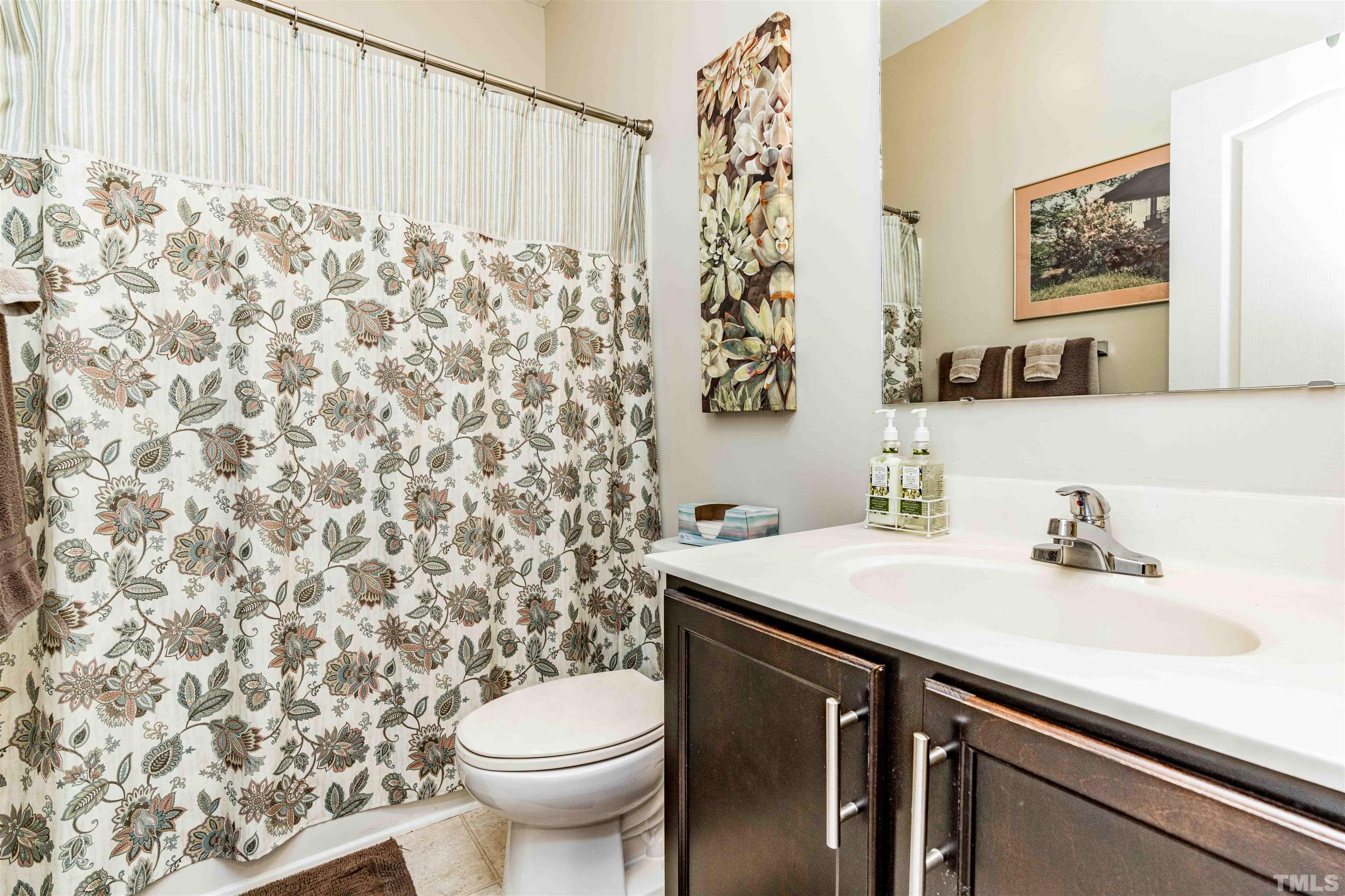 180 Crane Way Bunnlevel, NC 28323 - Photo 12 of 26 a bathroom with a sink toilet and a mirror