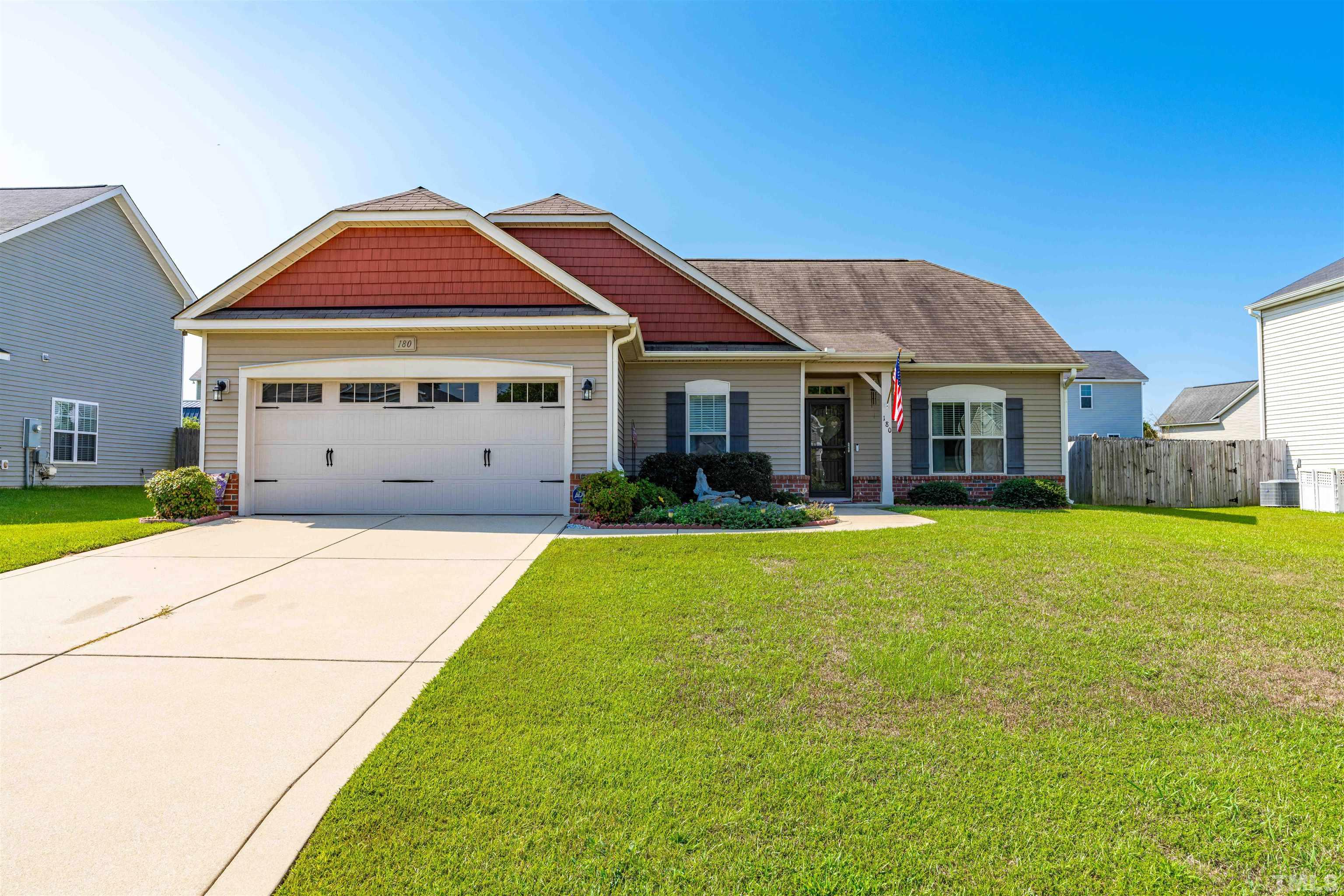 180 Crane Way Bunnlevel, NC 28323 - Photo 2 of 26 a front view of a house with a yard
