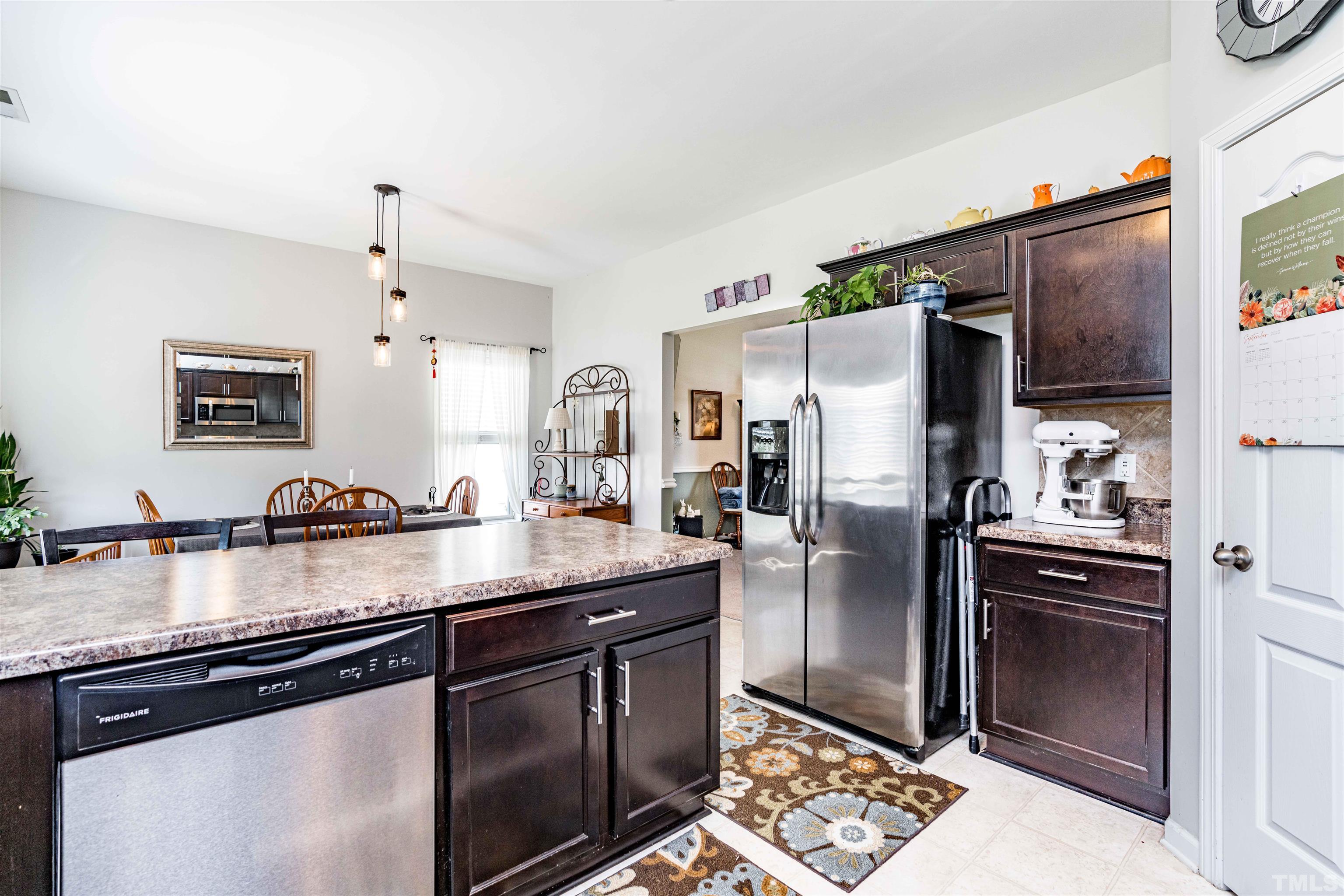 180 Crane Way Bunnlevel, NC 28323 - Photo 22 of 26 a kitchen with granite countertop a refrigerator stove and sink
