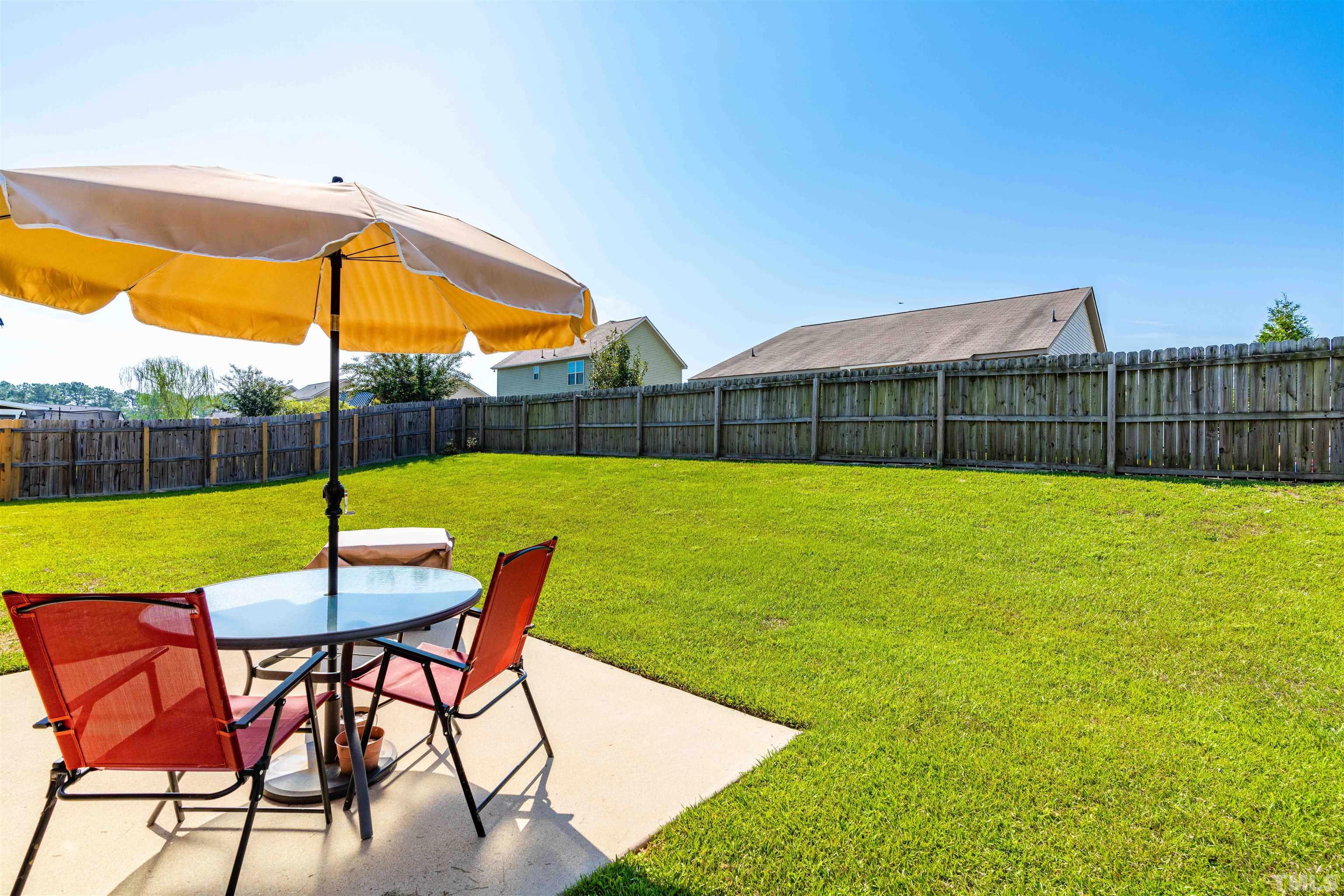 180 Crane Way Bunnlevel, NC 28323 - Photo 23 of 26 a view of yard with swimming pool outdoor seating and barbeque