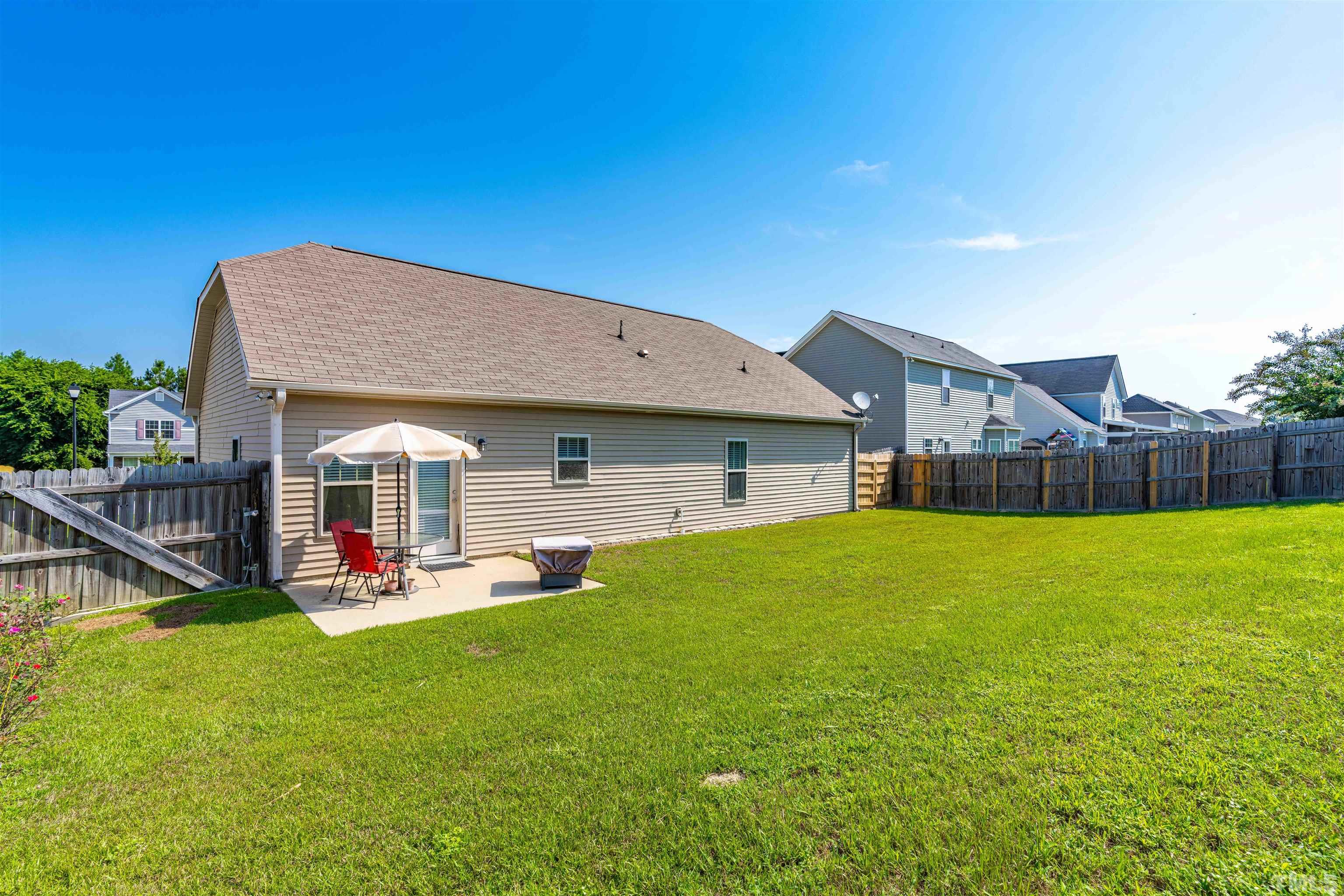 180 Crane Way Bunnlevel, NC 28323 - Photo 24 of 26 a front view of house with outdoor seating and yard