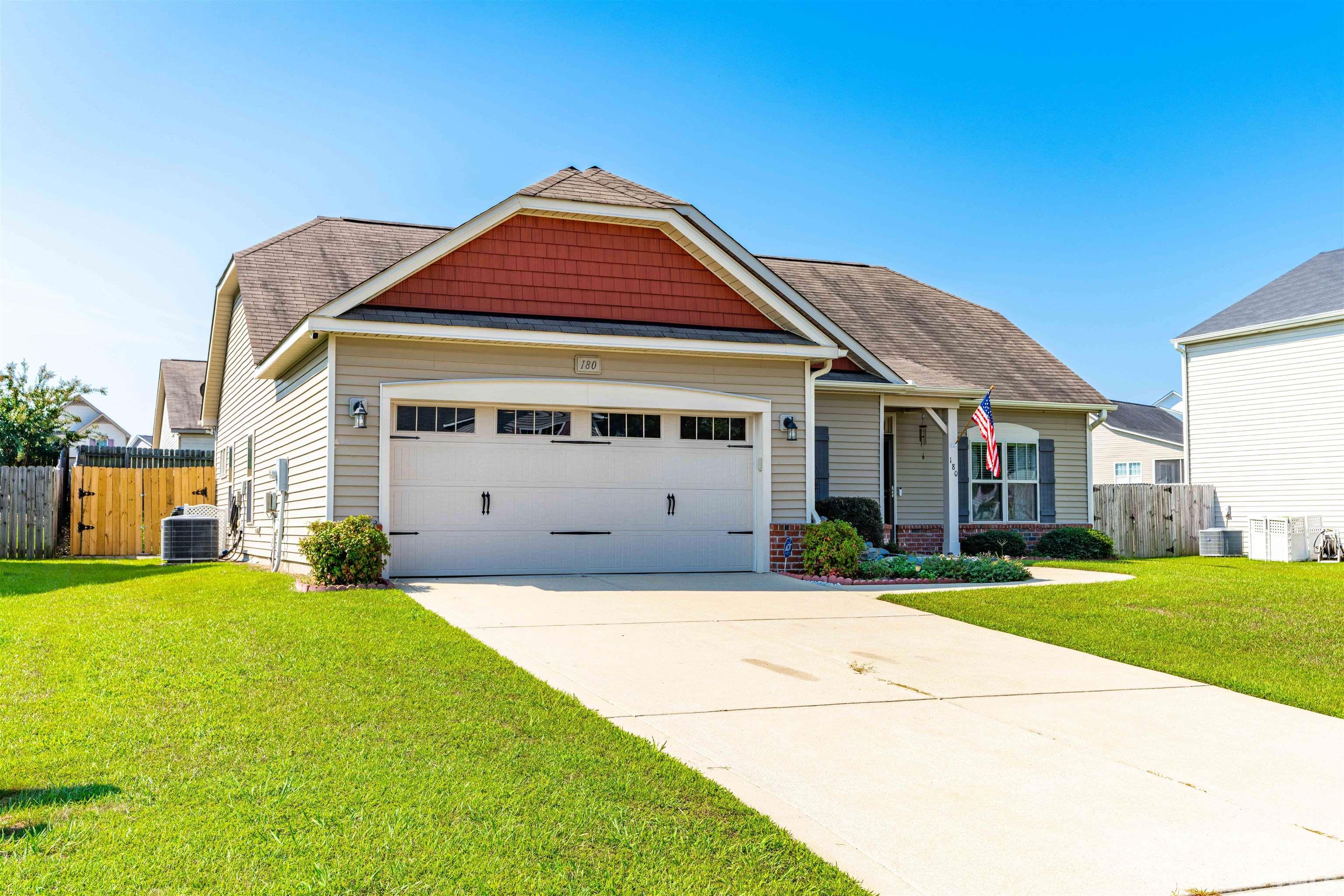 180 Crane Way Bunnlevel, NC 28323 - Photo 3 of 26 a front view of a house with a yard
