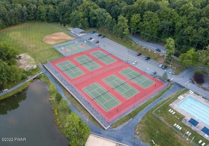 4141 Winchester Way Bushkill, PA 18324 - Photo 72 of 75 a aerial view of a pool patio lake and mountain view