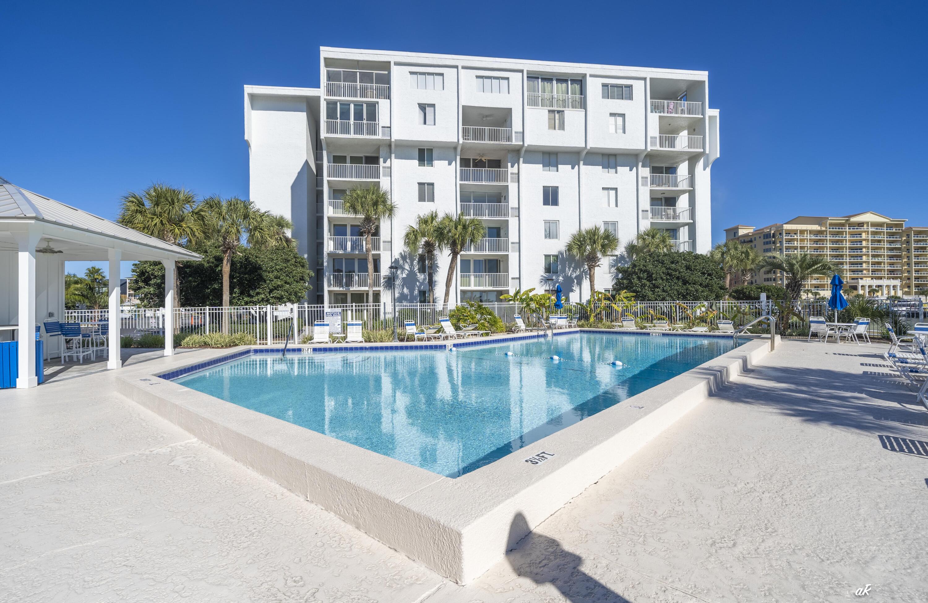 30 Moreno Point Road, Unit 404A Destin, FL 32541 - Photo 47 of 52 a view of a swimming pool with a patio