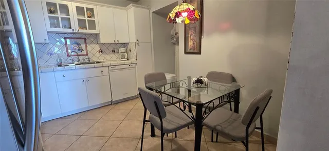 a living room with washer and dryer