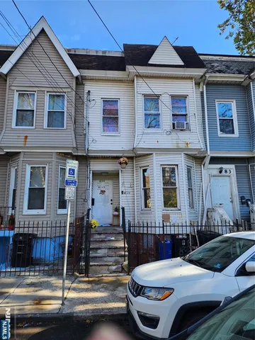 a front view of a house with swimming pool