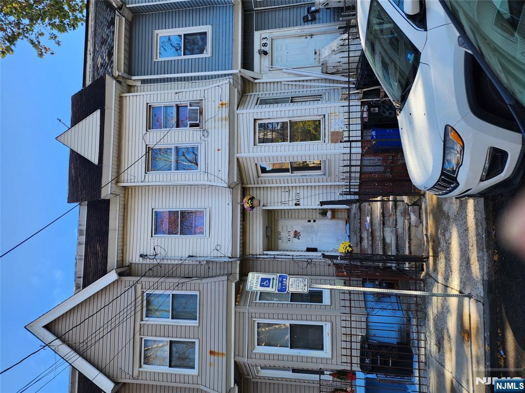 a front view of a house with swimming pool