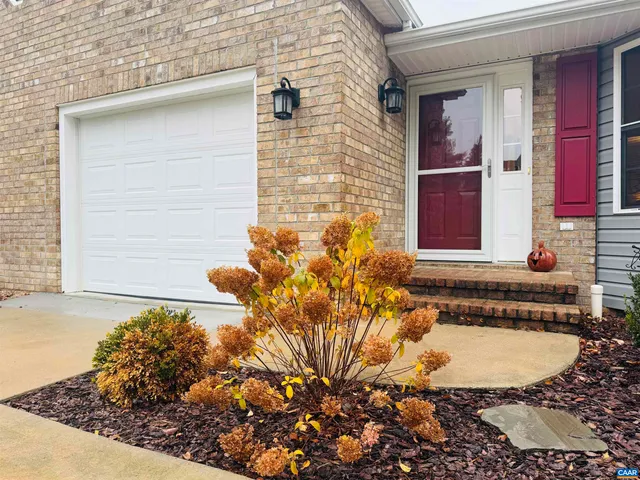 a view of a house with a small yard