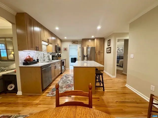 a spacious bedroom with a bed and a table