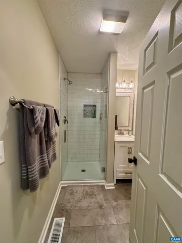 a kitchen with stainless steel appliances a stove a microwave and a refrigerator